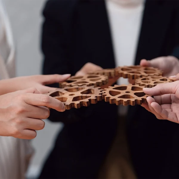 group-people-making-chain-gears-into-collective-form-harmony-symbol-1
